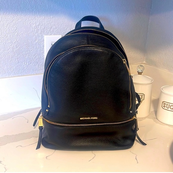 Michael Kors Handbags - Michael Kors Black Leather Backpack with Gold Hardware